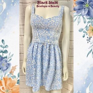 Blue & white flower print sleeveless mini dress with heart back cut out. Sz Sm
